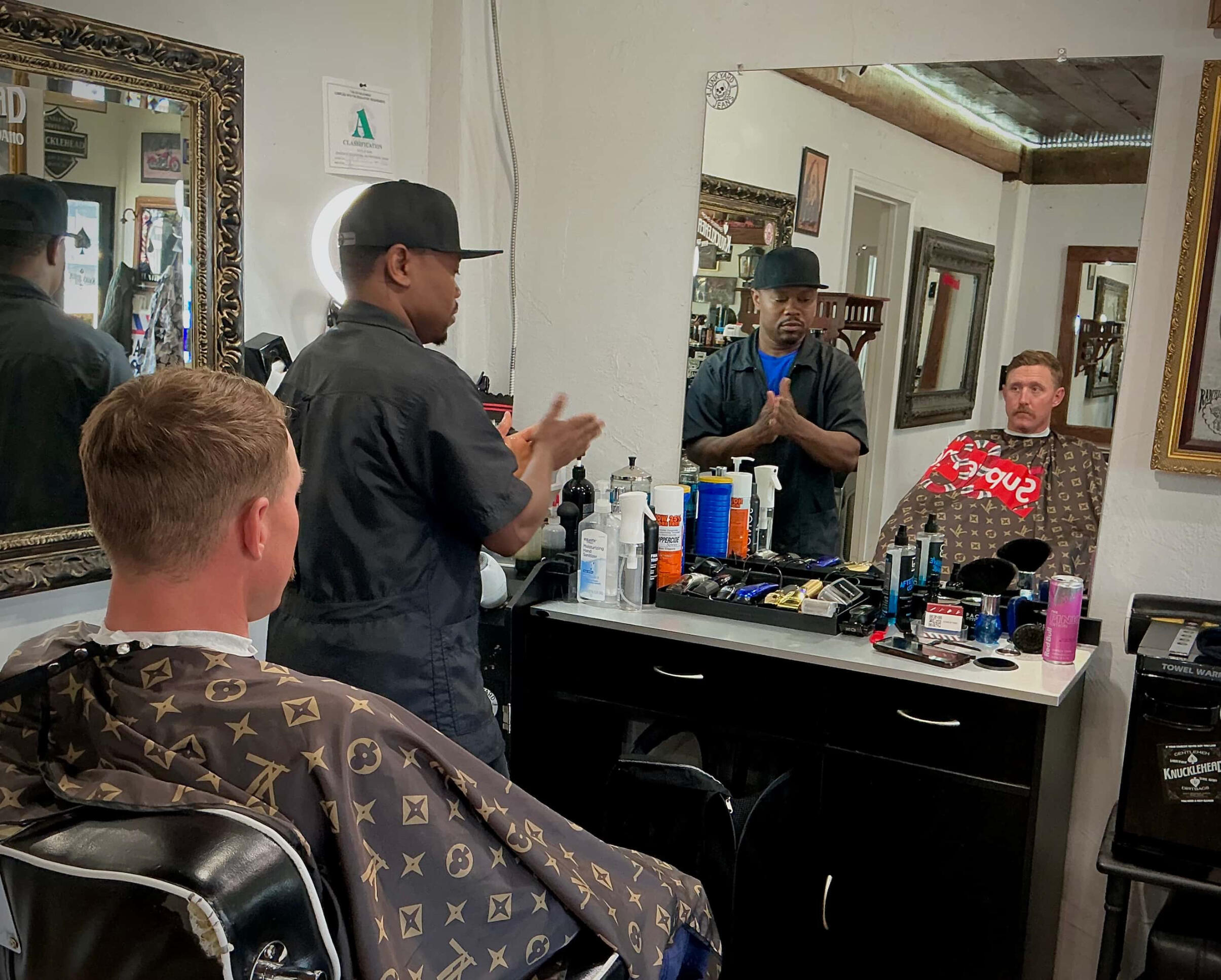 AJ Setuah delivering a clean fade in the Knucklehead Barbershop chair